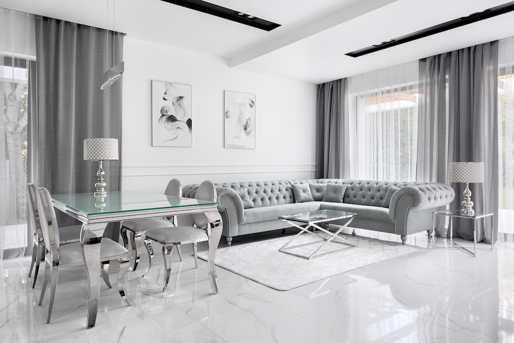 Hollywood Regency Design Style Living Room with grey, white and chrome