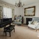 Traditional Interior Design Style Living space with black piano blue and beige furnishings