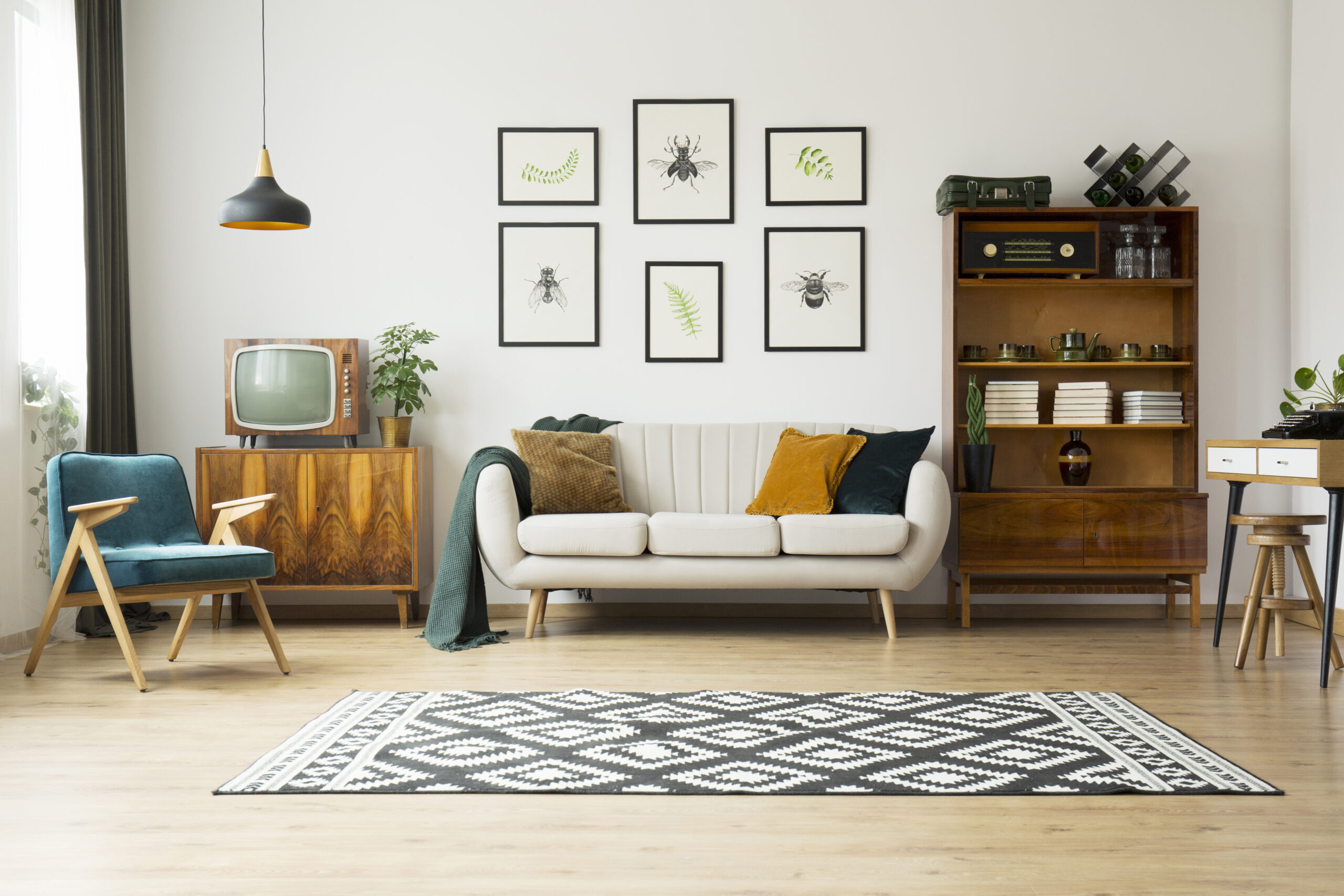 Vintage Retro Design Style Living Room with beige sofa and old TV and stereo