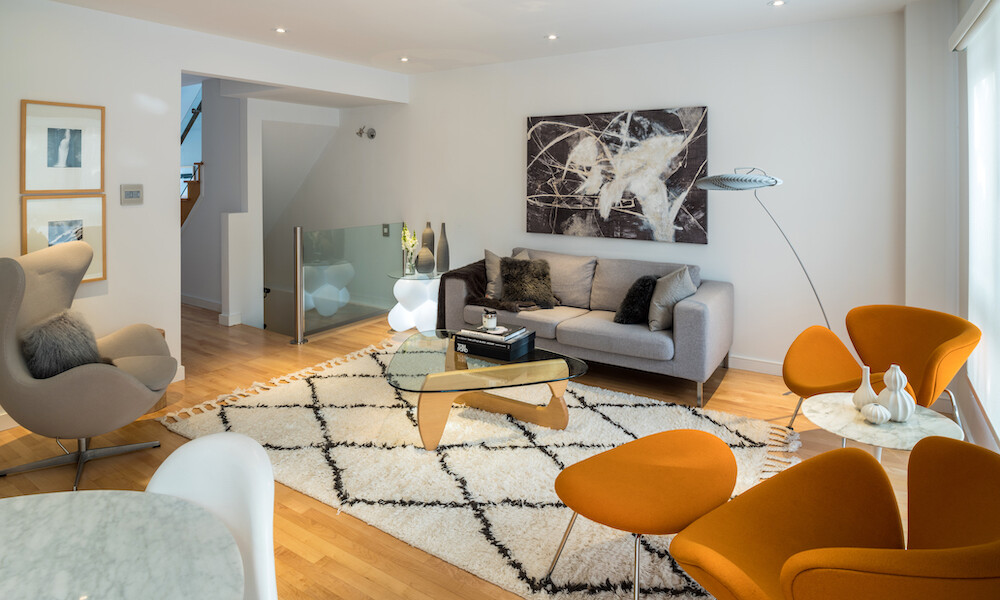 Contemporary Design Style Living Room with orange chairs, grey chair and sofa