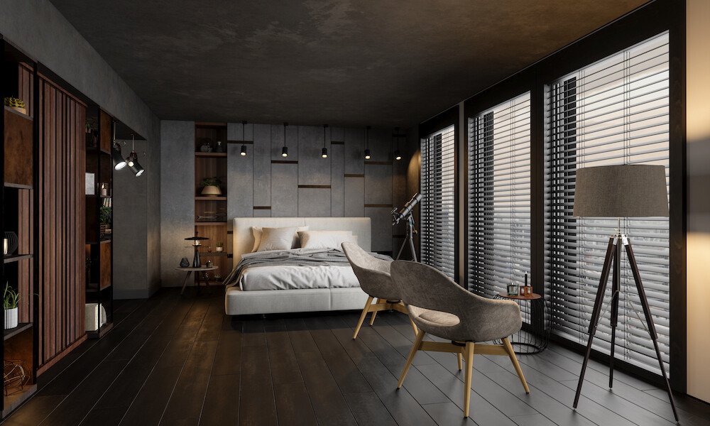 Modern Bedroom with white bed, grey and wood chairs and grey flooring