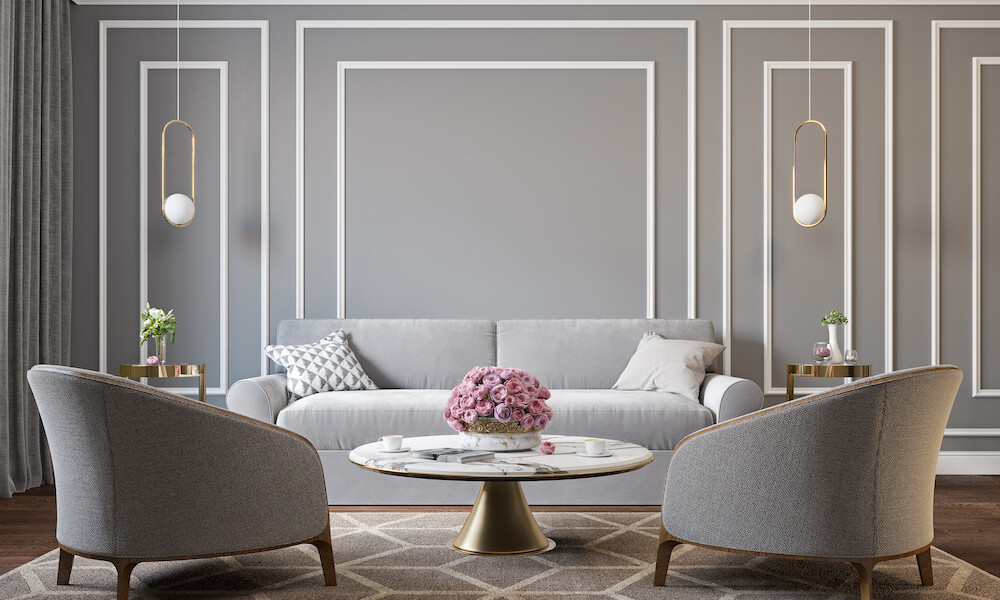 Classic gray interior with armchairs, sofa, coffee table, lamps, flowers and wall moldings. 3d render illustration mockup.