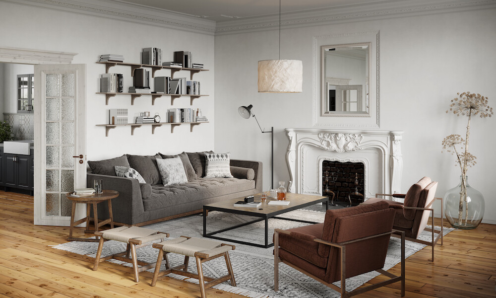 Eclectic Design Style Living Room with grey sofa and brown chairs with wooden bookshelves and vintage fireplace
