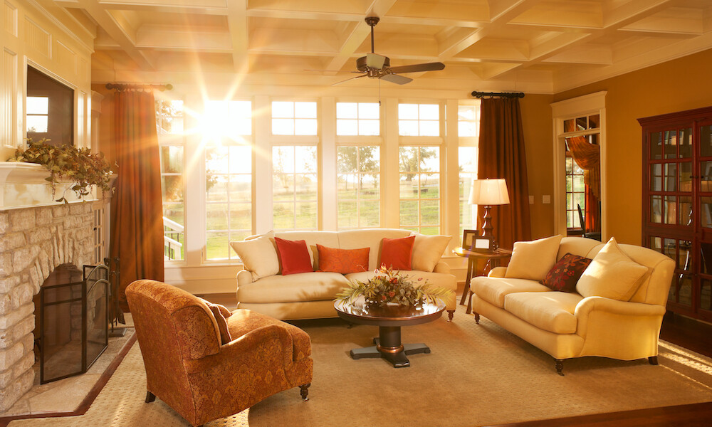 Transitional Design Dining Room with rust chairs and beige sofas