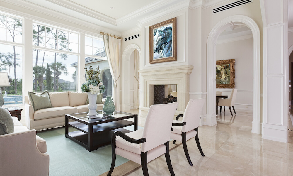 Transitional Living Room with white and black chairs and beige sofa with white fireplace