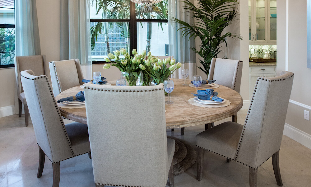 Transitional Design Dining Room with grey chairs and wood table