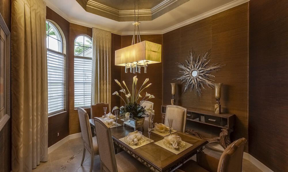Transitional Design Dining Room with brown tones and walls with rectangular chandelier