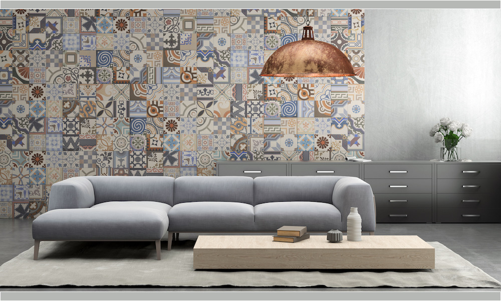 Interior with large blue vibrant sofa with coffee table, large pendant light above, tiles on the wall, with shelf and flowers, carpet. concrete wall, designer template. horizontal composition