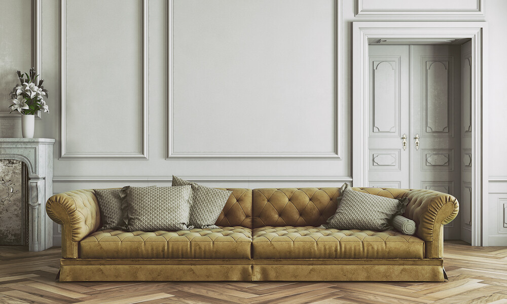 Retro styled living room with sofa and decoration on hardwood floor in front empty wall with copy space. Vintage effect applied. 3D rendered image.